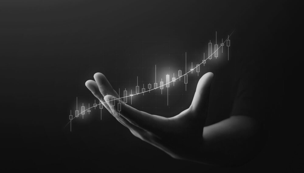 Businessman hand growth investment business stock finance profit graph background of marketing financial increase digital money trade chart and success global target economy on arrow market diagram.